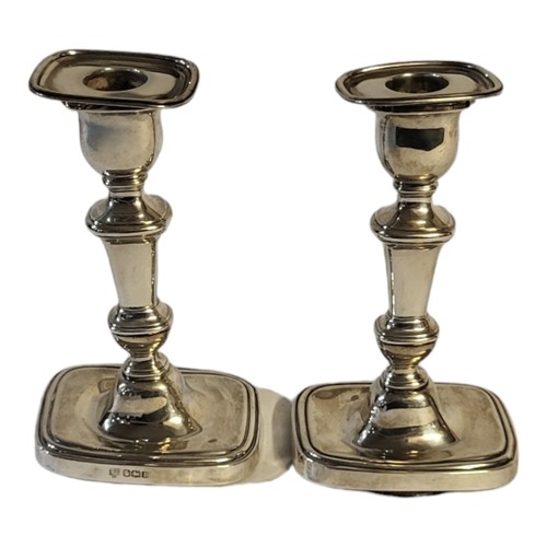 60 - A PAIR OF EARLY 20TH CENTURY SILVER CANDLESTICKS
Rectangular form with stepped base, hallmarked Hawk... 