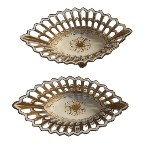 246 - A PAIR OF 19TH CENTURY CONTINENTAL PORCELAIN BASKETS
Lozenge form with pierced and gilded decoration... 