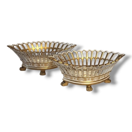 246 - A PAIR OF 19TH CENTURY CONTINENTAL PORCELAIN BASKETS
Lozenge form with pierced and gilded decoration... 