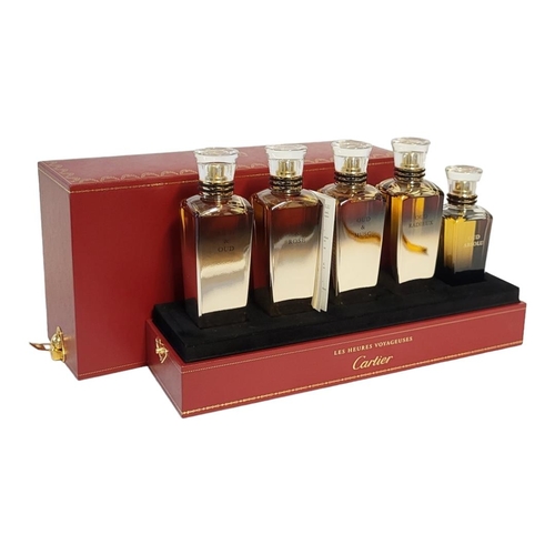 107 - CARTIER, A CASED 'LES HEURES VOYAGEUSES' FIVE PERFUME BOTTLE SET
Titled 'Oud and Oud, Oud and Rose, ... 