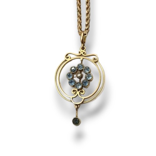 16 - AN EARLY 20TH CENTURY 9CT GOLD AND AQUAMARINE AND SEED PEARL PENDANT NECKLACE
The central pearl edge... 