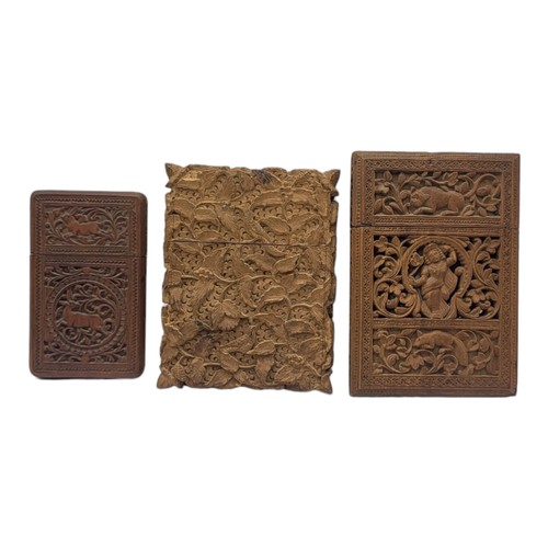 121 - A COLLECTION OF THREE 19TH CENTURY ANGLO INDIAN SANDALWOOD CALLING CARD CASES
Finely carved with ani... 