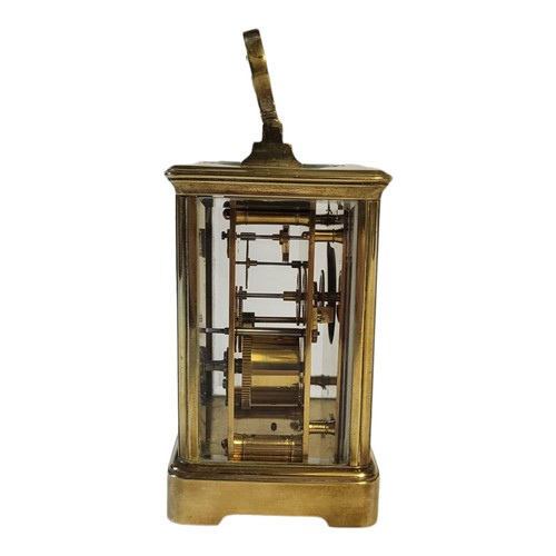 234 - AN EARLY 20TH CENTURY GILT BRASS CORNICHE CASED CARRIAGE CLOCK
The eight day movement, white enamel ... 