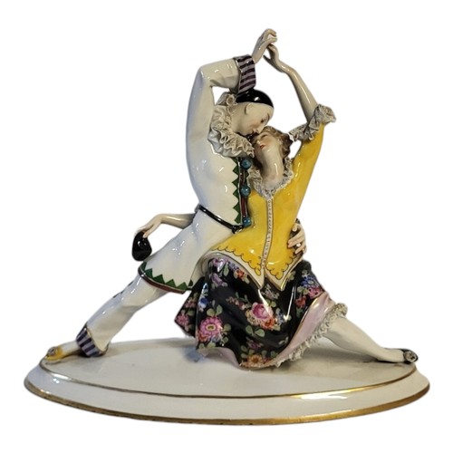 240 - A FINE ACKERMANN & FRITZE OF VOLKSTEDT, 1908 - 1936, AN ART DECO PORCELAIN GROUP, PIERROT AND FLAMEN... 