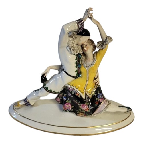 240 - A FINE ACKERMANN & FRITZE OF VOLKSTEDT, 1908 - 1936, AN ART DECO PORCELAIN GROUP, PIERROT AND FLAMEN... 