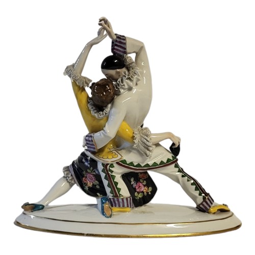 240 - A FINE ACKERMANN & FRITZE OF VOLKSTEDT, 1908 - 1936, AN ART DECO PORCELAIN GROUP, PIERROT AND FLAMEN... 