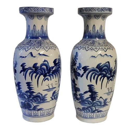 248 - A PAIR OF 20TH CENTURY CHINESE BLUE AND WHITE BALUSTER FORM PORCELAIN VASES
Flora and fauna pattern,... 