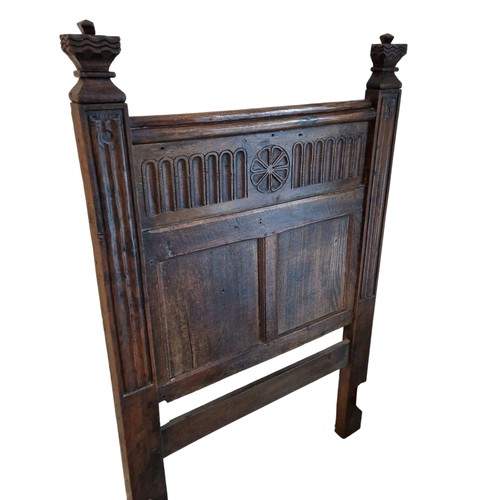 528 - A PAIR OF 19TH CENTURY GOTHIC DESIGN CARVED OAK SINGLE BEDS
Having linen fold and wheel design.
(eac... 