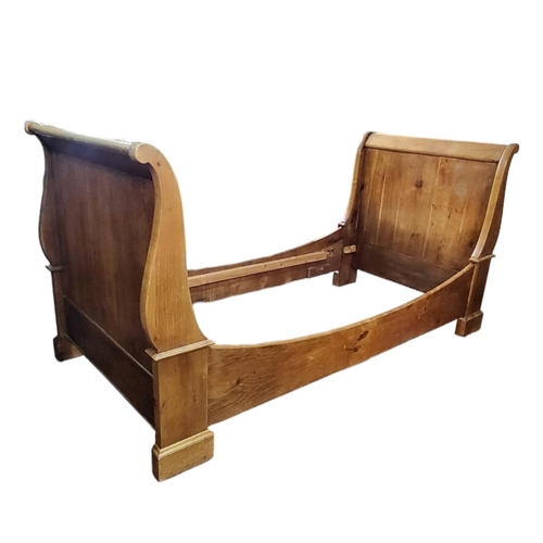 537 - A 20TH CENTURY OAK LAURA ASHLEY SINGLE SLEIGH BED
(length 184cm x 98cm x h 103cm)

Condition: good o... 