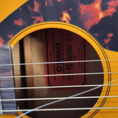 169A - YAMAHA, A VINTAGE FG JUNIOR ACOUSTIC GUITAR
Having a faux tortoise shell guard, bearing label ‘Yamah... 