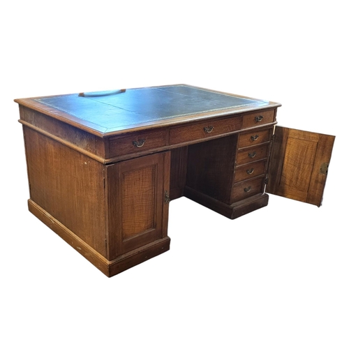 547 - A VICTORIAN OAK PARTNER'S DESK
With green tooled leather writing surface above arrangement of fourte... 