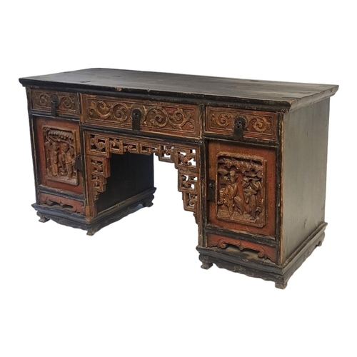 549 - A CHINESE EXPORT QING DYNASTY HARDWOOD NOVELTY PARTNER’S PEDESTAL DESK
Having an arrangement of thre... 