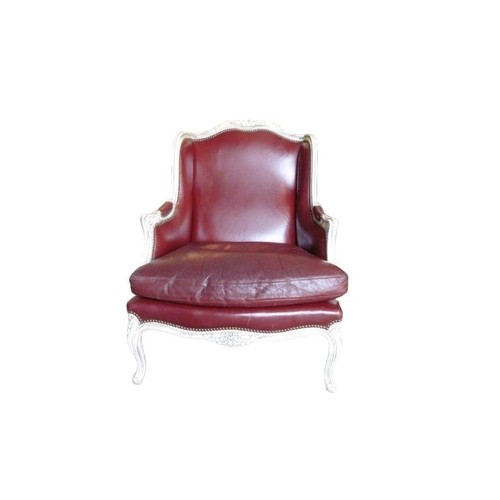 567 - A FRENCH LOUIS XVI DESIGN CARVED WOOD AND PAINTED RED LEATHER WINGBACK ARMCHAIR
The shaped back and ... 