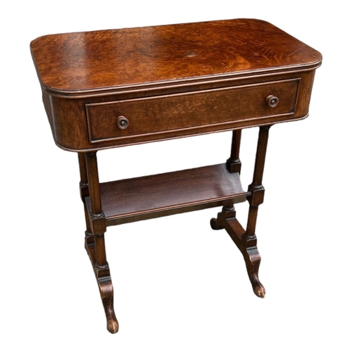 578 - A REGENCY STYLE BURR WALNUT SIDE TABLE
The single drawer above book trough, with turned columns and ... 