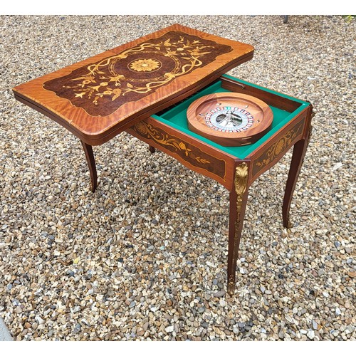 505 - DAL NEGRO, A 20TH CENTURY ITALIAN WALNUT AND MARQUETRY GAMES/ROULETTE TABLE
Having inlaid floral pan... 