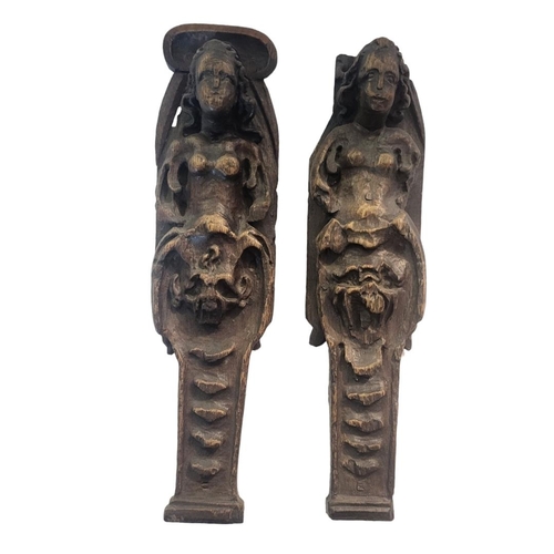 351 - A PAIR OF 17TH CENTURY CARVED OAK CARYATIDS
Half female form with grotesque masks.
(approx 35cm)

Co... 