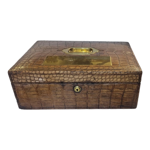 352 - J.T. NEEDS OF PICCADILLY, A VICTORIAN CROCODILE  SKIN AND BRASS DESPATCH BOX
Having a single brass h... 