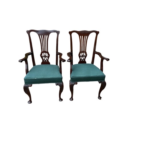 581 - A PAIR OF EARLY 20TH MAHOGANY OPEN ARMCHAIRS
With pierced vase splat backs, overstuffed upholstered ... 