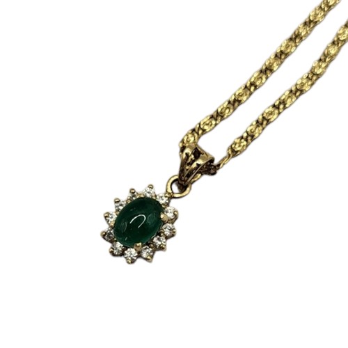 145 - A VINTAGE EMERALD AND DIAMOND PENDANT NECKLACE
Cabochon cut emerald edged with diamonds, on a fancy ... 