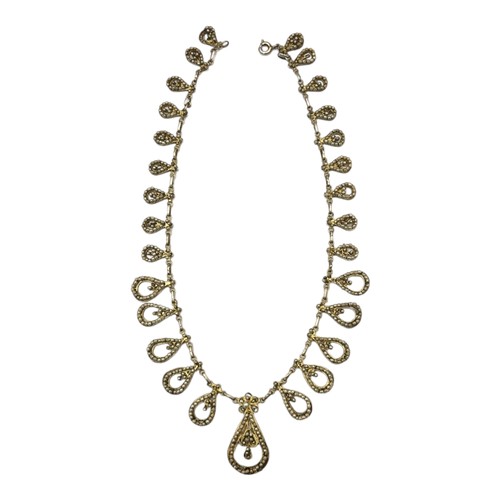 147 - AN EARLY 20TH CENTURY CONTINENTAL SILVER GILT AND SEED PEARL FILIGREE NECKLACE
The graduated row of ... 