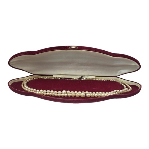 149 - A VINTAGE PEARL NECKLACE
Having a row of graduated simulated pearls with silver clasp, in a fitted r... 