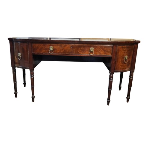 584 - A GEORGE III PERIOD MAHOGANY SIDEBOARD/BUFFET
The three drawers with original brass lion mask handle... 