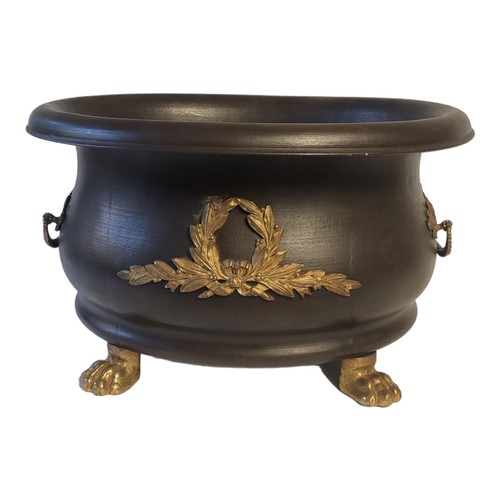 354 - AN EARLY 20TH CENTURY EMPIRE STYLE METAL BLACK PATINATED TUREEN SHAPE TWIN HANDLED URN/JARDINIERE
Th... 