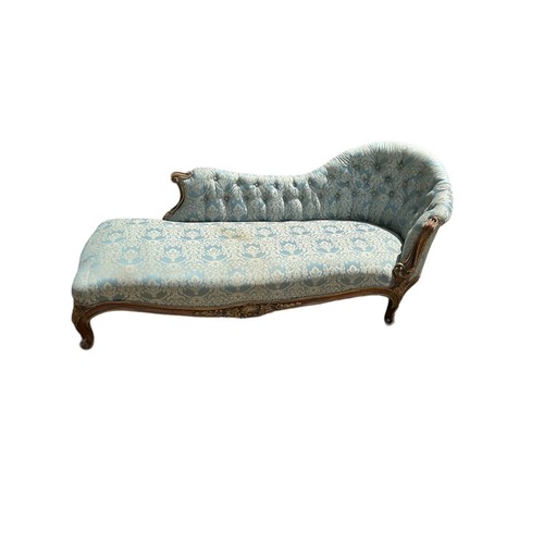 587 - A VICTORIAN MAHOGANY SERPENTINE CHAISE LONGUE
Upholstered in patterned turquoisefabric with piped bo... 