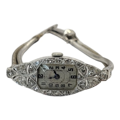 12A - AN ART DECO PLATINUM AND DIAMOND LADIES’ COCKTAIL WATCH
Tapering lozenge form, set with diamonds and... 