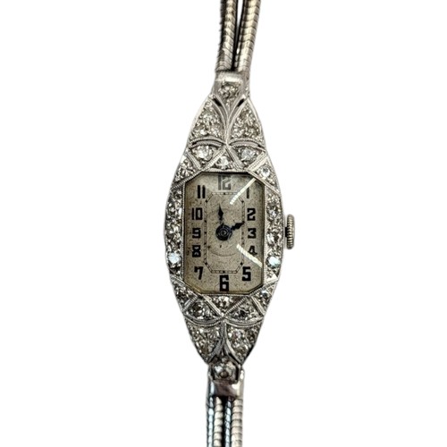 12A - AN ART DECO PLATINUM AND DIAMOND LADIES’ COCKTAIL WATCH
Tapering lozenge form, set with diamonds and... 