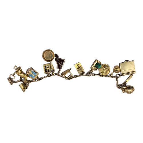 13A - AN EARLY 20TH CENTURY 9CT GOLD CHARM BRACELET
Set with thirteen charms including a cow, ship's lante... 