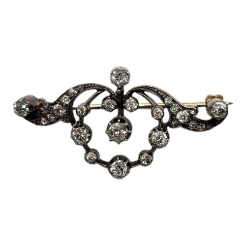 18A - AN EARLY 20TH CENTURY WHITE METAL AND DIAMOND BROOCH
Having an arrangement of round cut diamonds in ... 