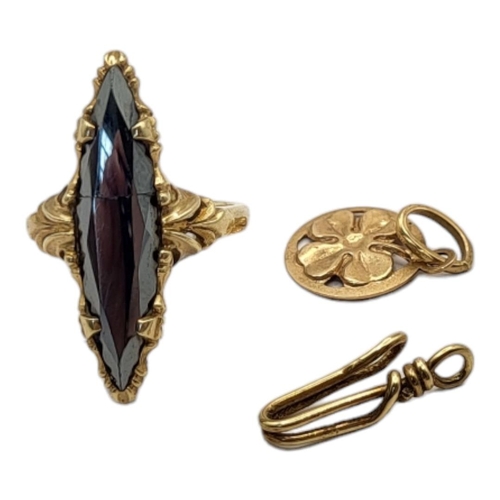 22A - A CONTINENTAL 10CT GOLD AND HEMATITE RING
Marquis cut stone in a scrolled mount, together with a sma... 