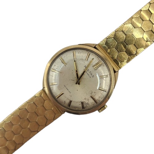 26A - MISTAS, A VINTAGE 9CT GOLD GENT’S WATCH ON 18CT GOLD STRAP
Marked number ‘3020’ to case, on honeycom... 