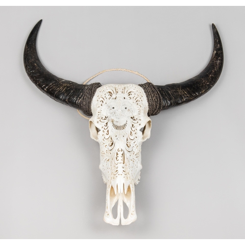 125 - A MID-20TH CENTURY CARVED BALI WATER BUFFALO SKULL (BUBALUS BUBALIS).
Quality and intricate carvings... 