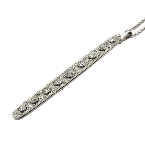 42 - AN ART DECO WHITE METAL AND DIAMOND PENDANT NECKLACE
Having a row of graduated round cut diamonds wi... 