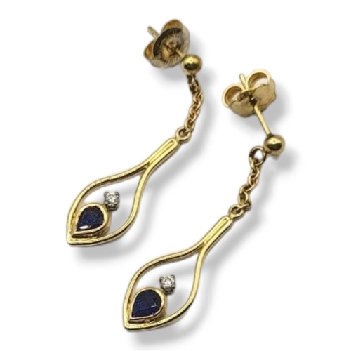 34 - A PAIR OF VINTAGE 18CT GOLD, SAPPHIRE AND DIAMOND EARRINGS
The pear cut sapphire set with two round ... 