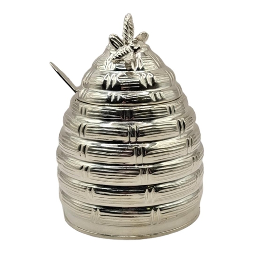 55 - A SILVER PLATED HONEY POT
Taking the form of a hive with bee decorations to lid, glass insert and sp... 