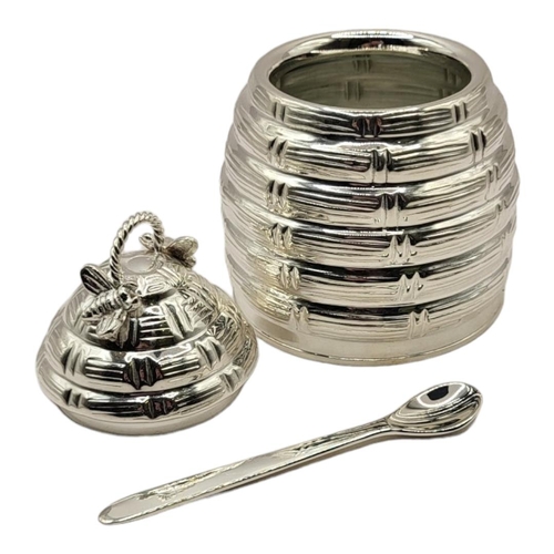 55 - A SILVER PLATED HONEY POT
Taking the form of a hive with bee decorations to lid, glass insert and sp... 