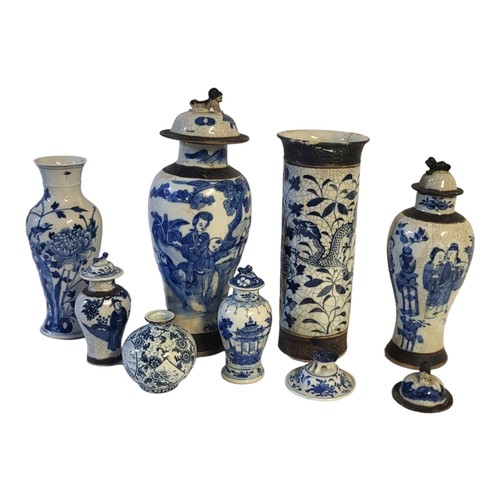 491 - A COLLECTION OF SIX LATE 19TH/EARLY 20TH CENTURY CHINESE BLUE AND WHITE CRACKLE GLAZE POTTERY VASES
... 