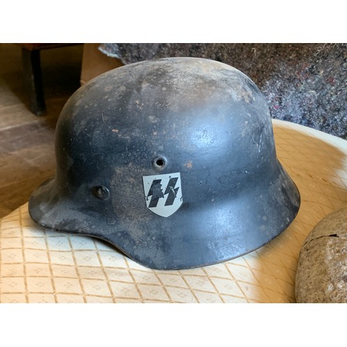 340 - A GERMAN WWII SS M35 STEEL HELMET WITH DOUBLE DECALS.

Decals probably later. Please study the detai... 