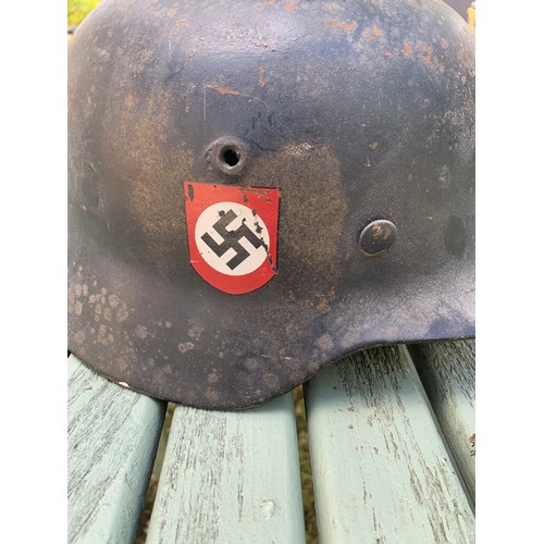 340 - A GERMAN WWII SS M35 STEEL HELMET WITH DOUBLE DECALS.

Decals probably later. Please study the detai... 