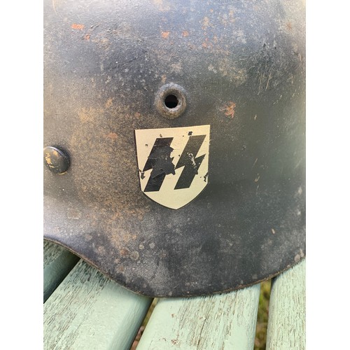 340 - A GERMAN WWII SS M35 STEEL HELMET WITH DOUBLE DECALS.

Decals probably later. Please study the detai... 