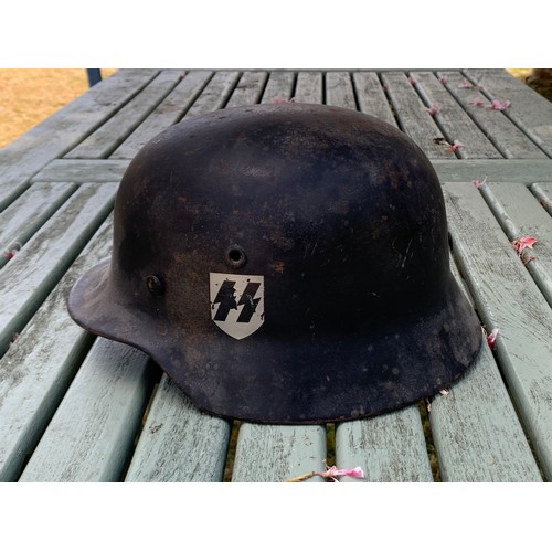 340 - A GERMAN WWII SS M35 STEEL HELMET WITH DOUBLE DECALS.

Decals probably later. Please study the detai... 