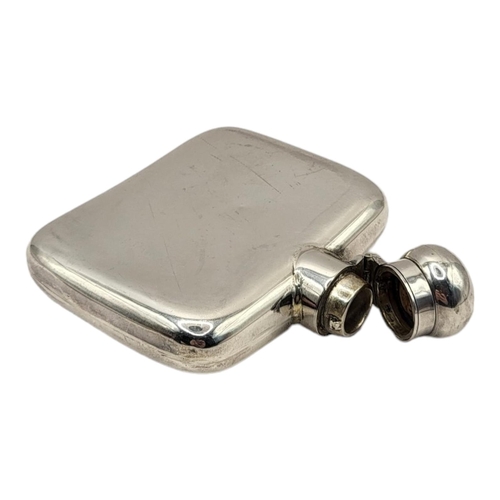 24 - A MID EDWARDIAN HALLMARKED SILVER MOUNTED HIP FLASK OF PLAIN DESIGN
Marked for Chester, 1905.
(10cm ... 