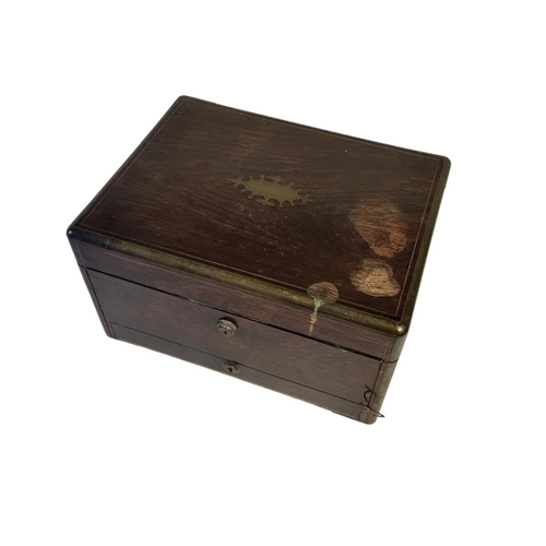 25 - AN EARLY VICTORIAN BRASS BOUND COROMANDEL VANITY TOILET BOX AND COVER, CIRCA 1850
The lid and fall f... 