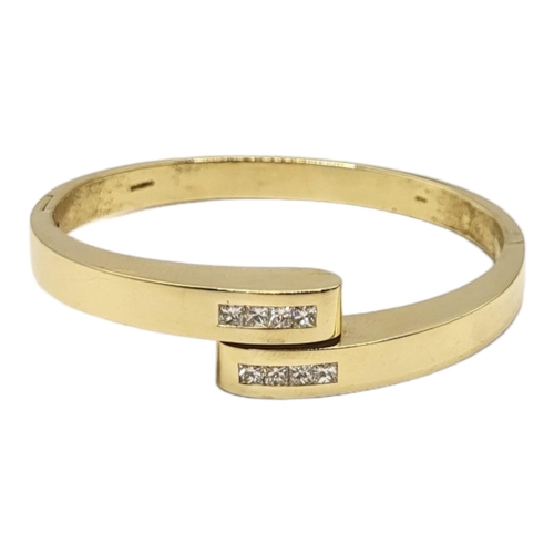 40A - MAPPIN AND WEBB, AN 18CT GOLD AND DIAMOND BANGLE
Heavy gauge set with two rows of four Princess cut ... 