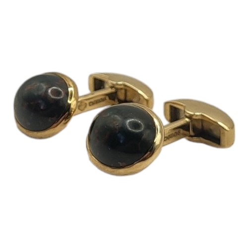46A - ASPREY, A PAIR OF 9CT GOLD AND BLOODSTONE GENT’S CUFFLINKS
Each set with a cabochon cut stone in a c... 