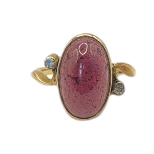67 - AN EARLY 20TH CENTURY YELLOW METAL, AMETHYST AND DIAMOND RING
Oval cabochon cut stone edged with dia... 