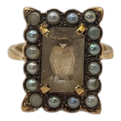 68 - AN EARLY 20TH CENTURY 9CT GOLD, SMOKY QUARTZ AND SEED PEARL RING
The rectangular cut stone,edged wit... 